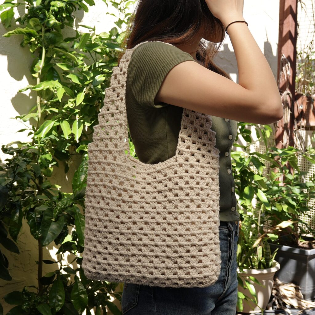 crochet granny stitch tote bag worn on shoulder edited