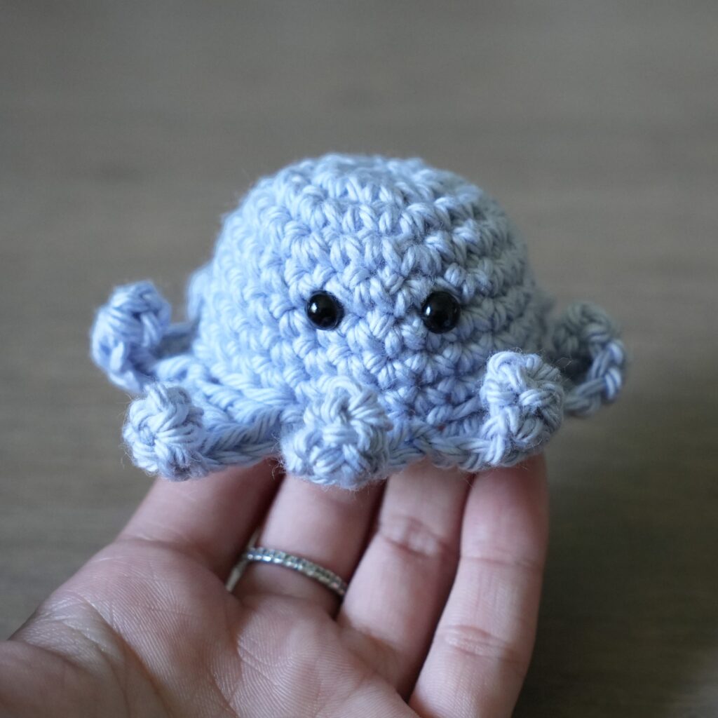 mini crochet octopus on hand2.2