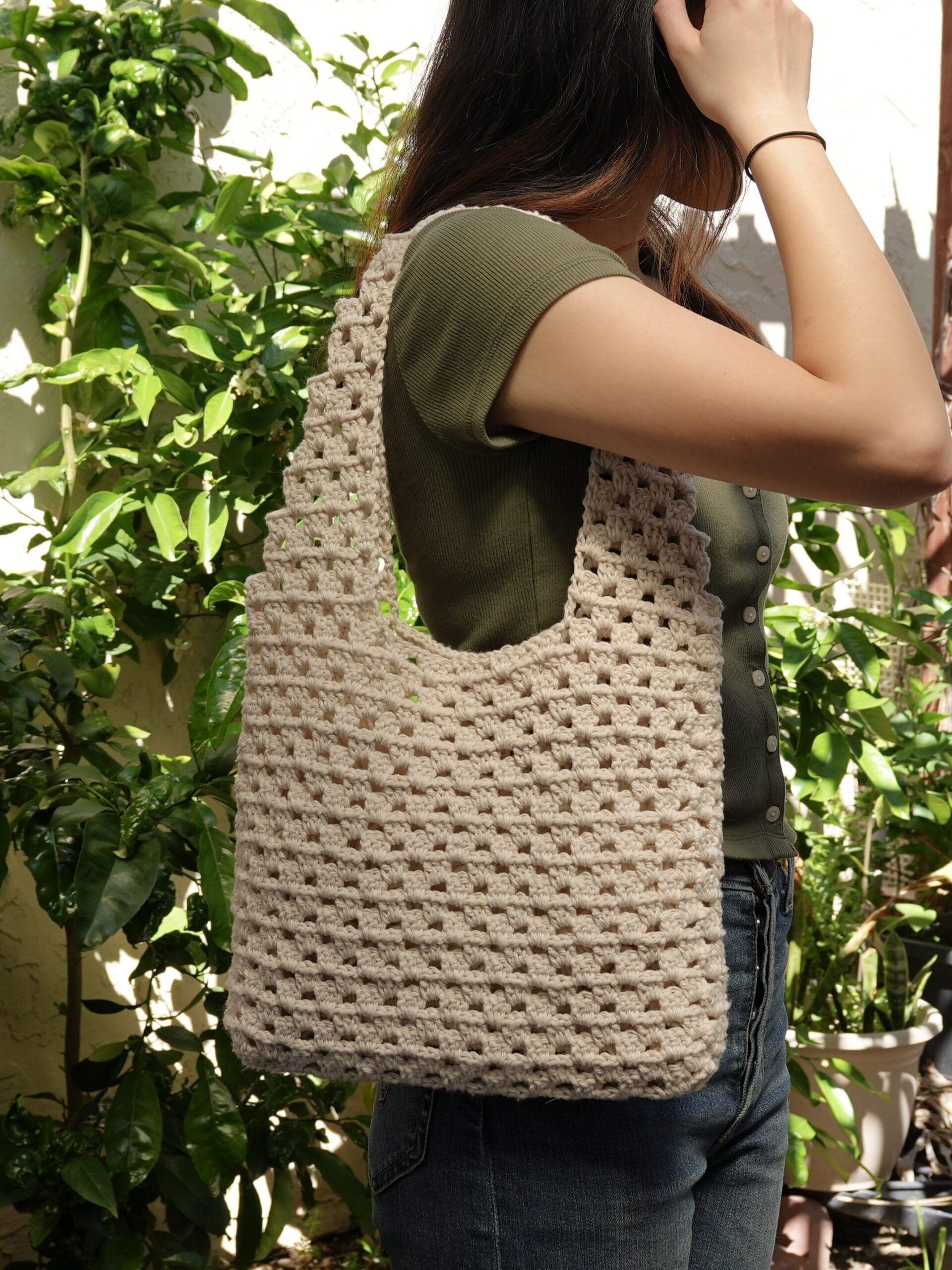 crochet granny stitch tote bag worn on shoulder