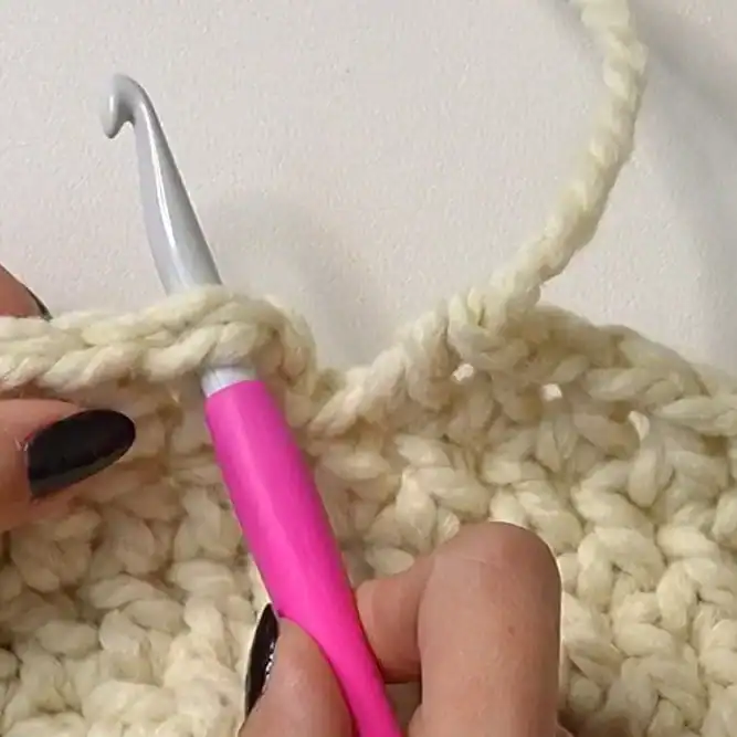 Insert your hook into the first stitch of the last round